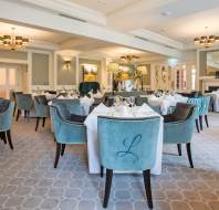 Dining room with monogrammed soft chairs