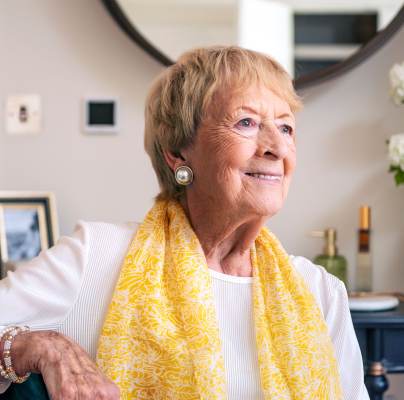 Older woman seated at home