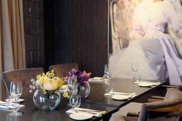 Private dining room at The Lytton restaurant Place setting at dark wood table