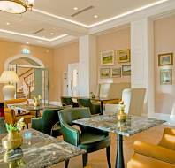 Leather chairs and marble-topped tables