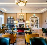 Grand drawing room with chairs and tables