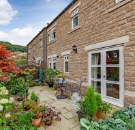 Well tended garden with patio