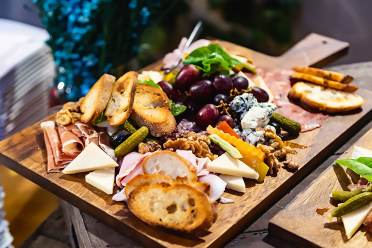 A Christmas platter with something for everyone Bread, cheese, fruit and cold meats