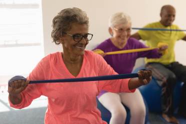 Older people fitness class on exercise balls